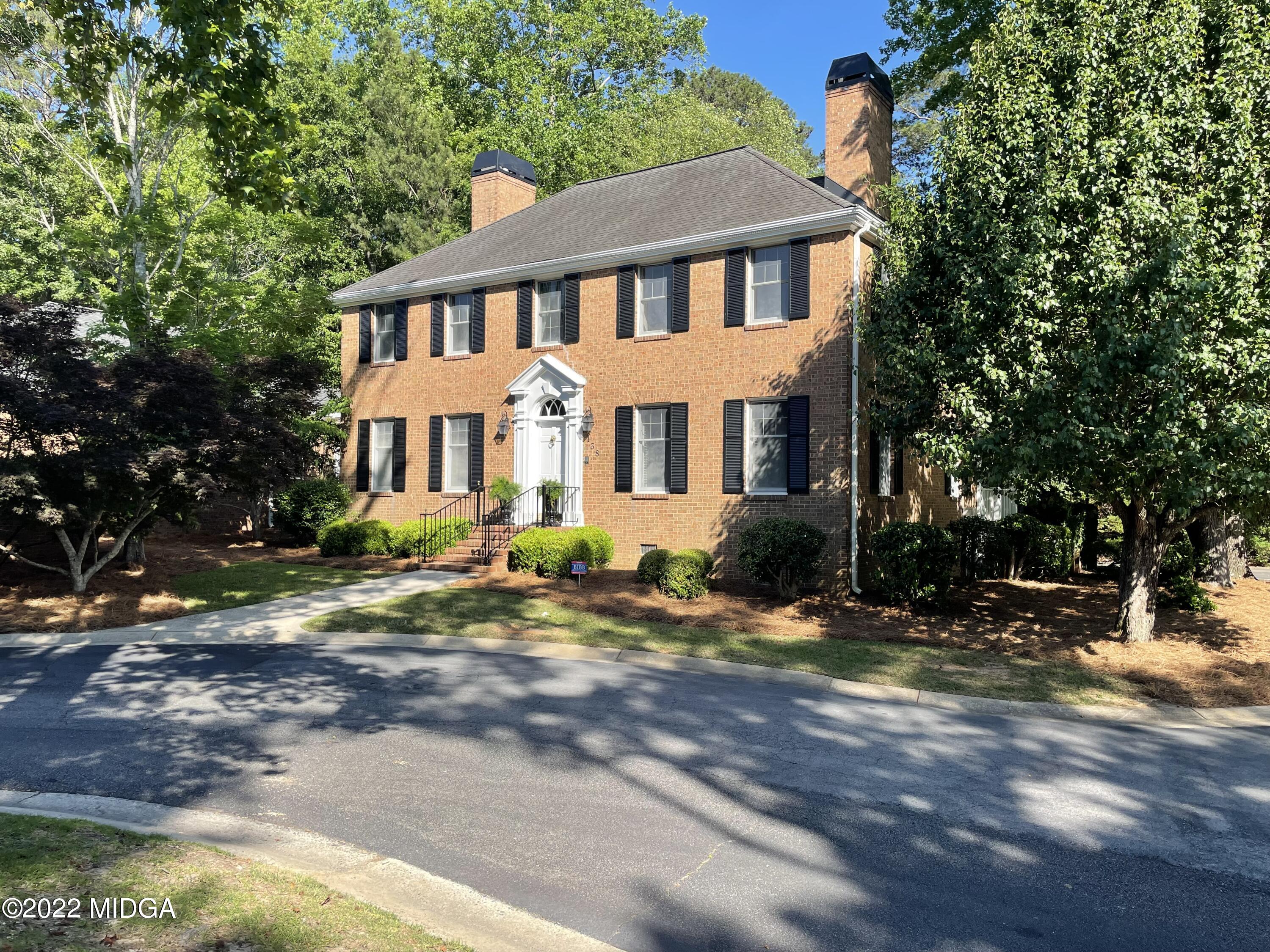138 Covington Place, Unit 13 Macon, GA 31210 - Photo 1 of 23 a view of a white house with large windows next to a road