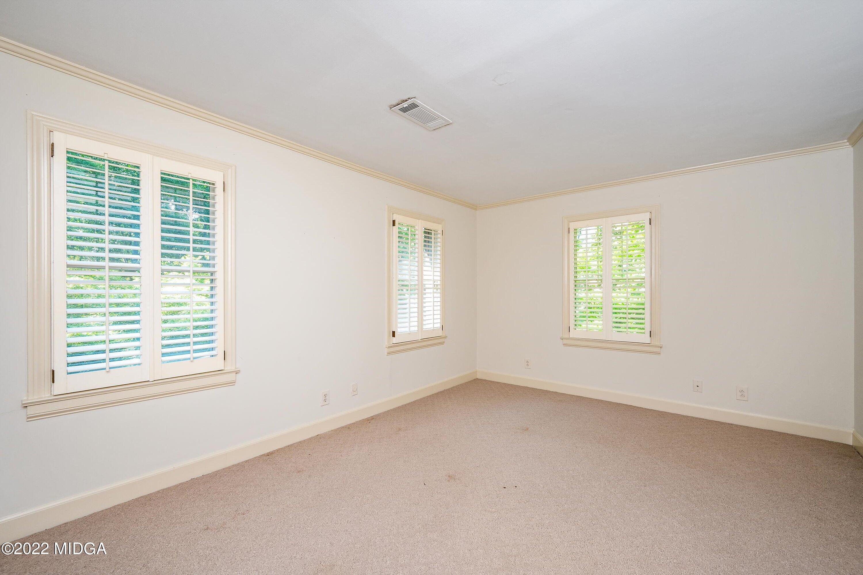 138 Covington Place, Unit 13 Macon, GA 31210 - Photo 14 of 23 a view of an empty room with a window