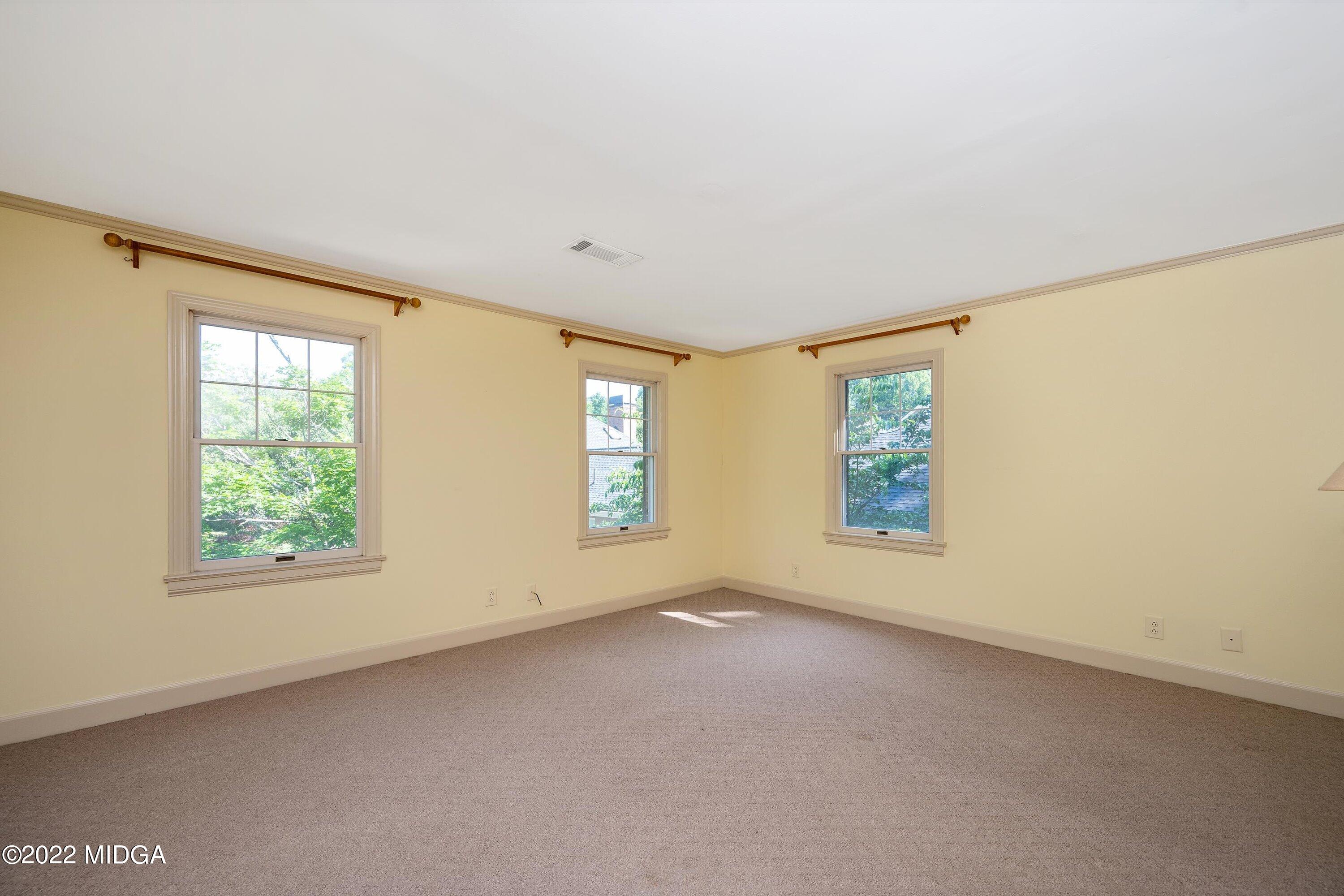 138 Covington Place, Unit 13 Macon, GA 31210 - Photo 15 of 23 an empty room with windows