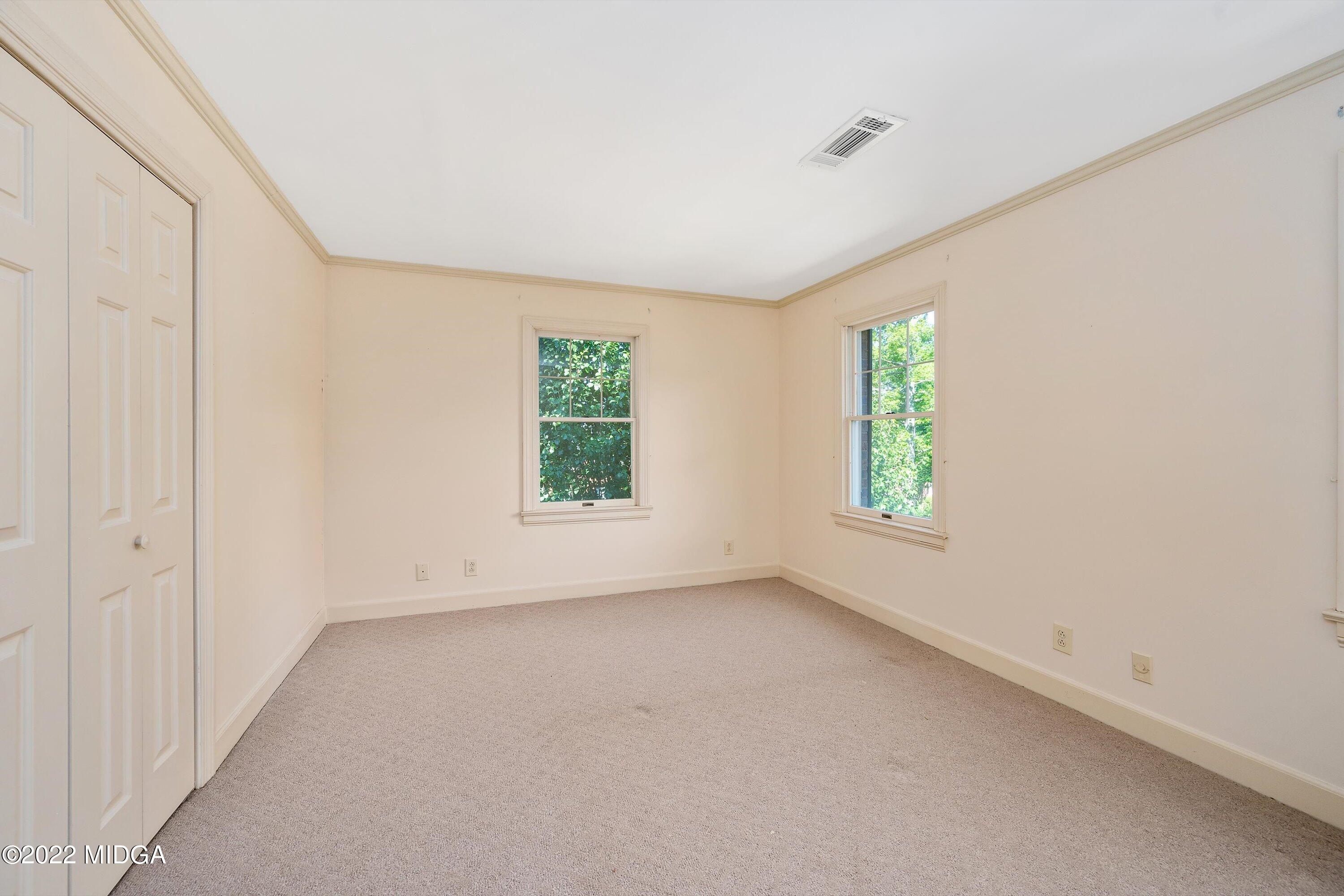 138 Covington Place, Unit 13 Macon, GA 31210 - Photo 16 of 23 an empty room with windows