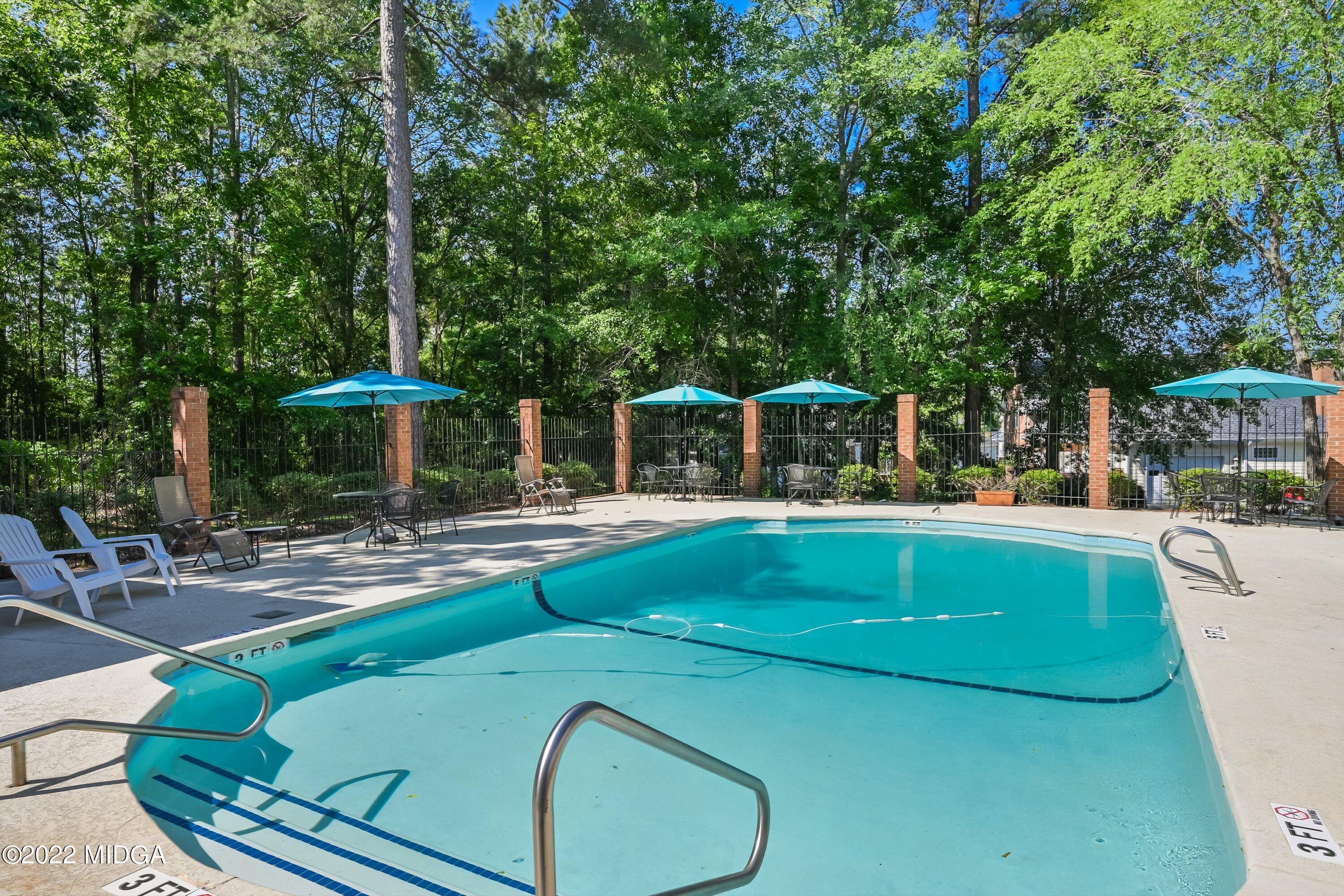 138 Covington Place, Unit 13 Macon, GA 31210 - Photo 18 of 23 a view of a swimming pool with chairs