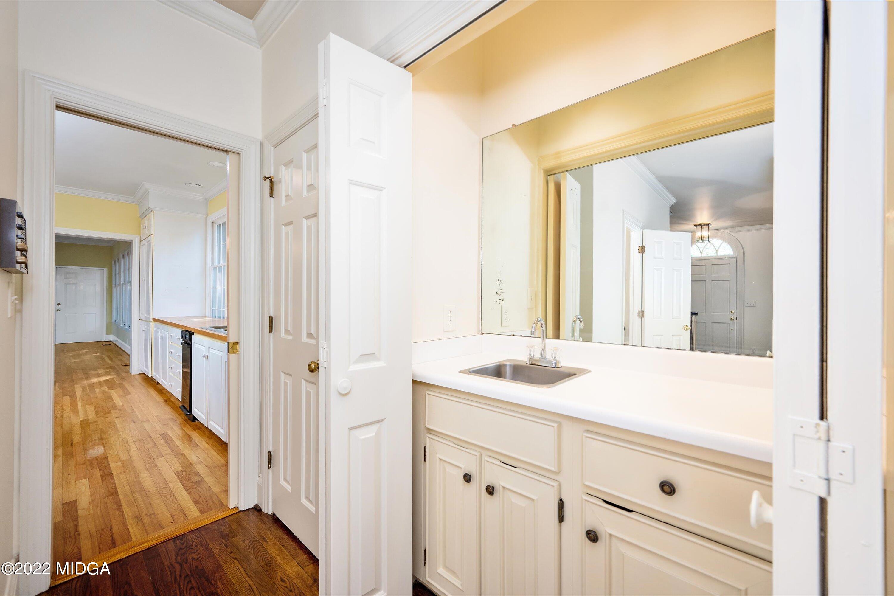 138 Covington Place, Unit 13 Macon, GA 31210 - Photo 9 of 23 a en suite bathroom with a sink mirror and vanity