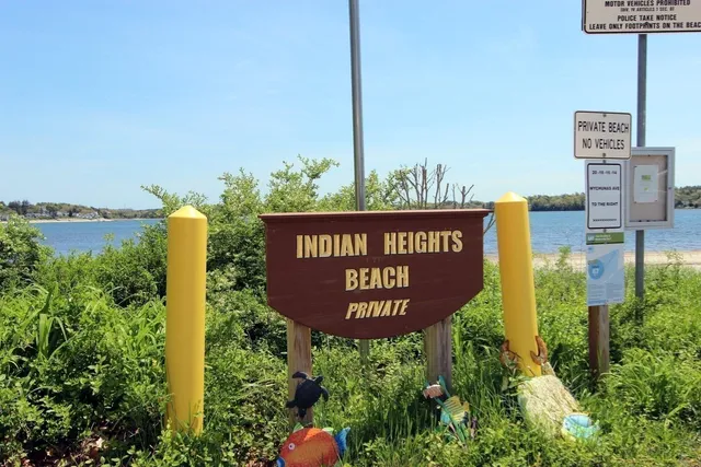 a view of a lake with houses in the background
