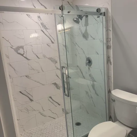 a bathroom with a sink mirror vanity and toilet