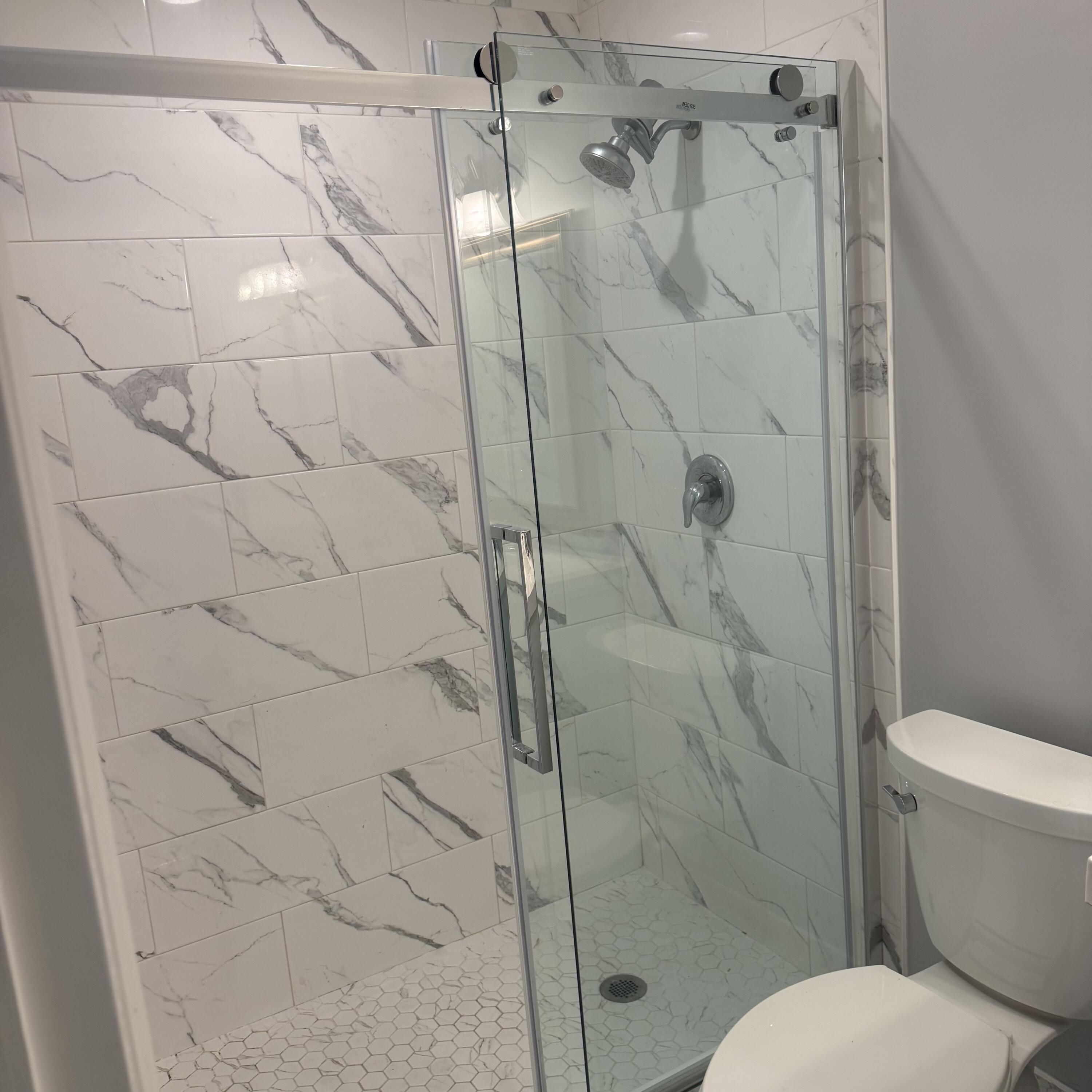 431 Jupiter Lakes Boulevard, Unit 2112A Jupiter, FL 33458 - Photo 11 of 19 a bathroom with a toilet and shower