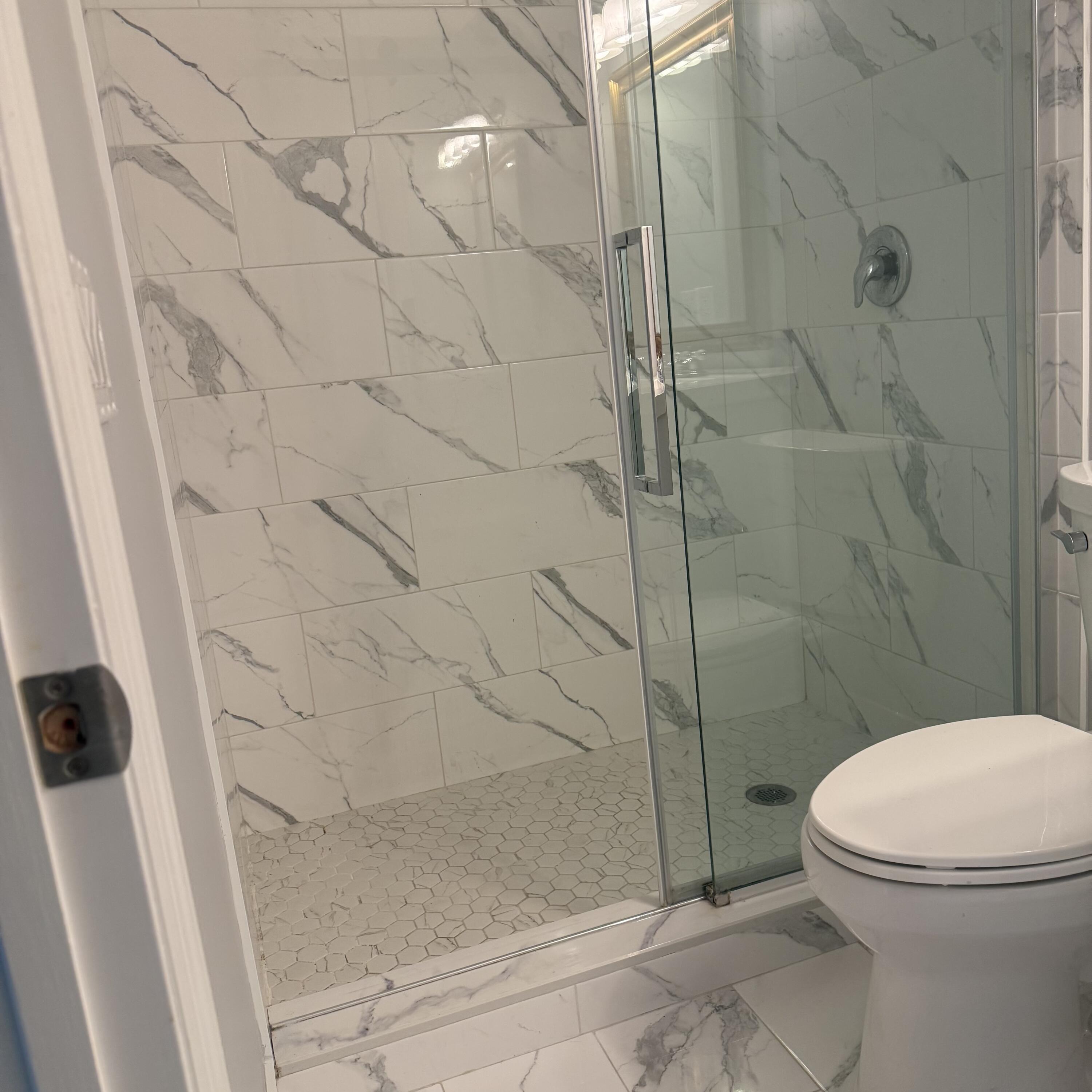 431 Jupiter Lakes Boulevard, Unit 2112A Jupiter, FL 33458 - Photo 13 of 19 a bathroom with a toilet and a shower