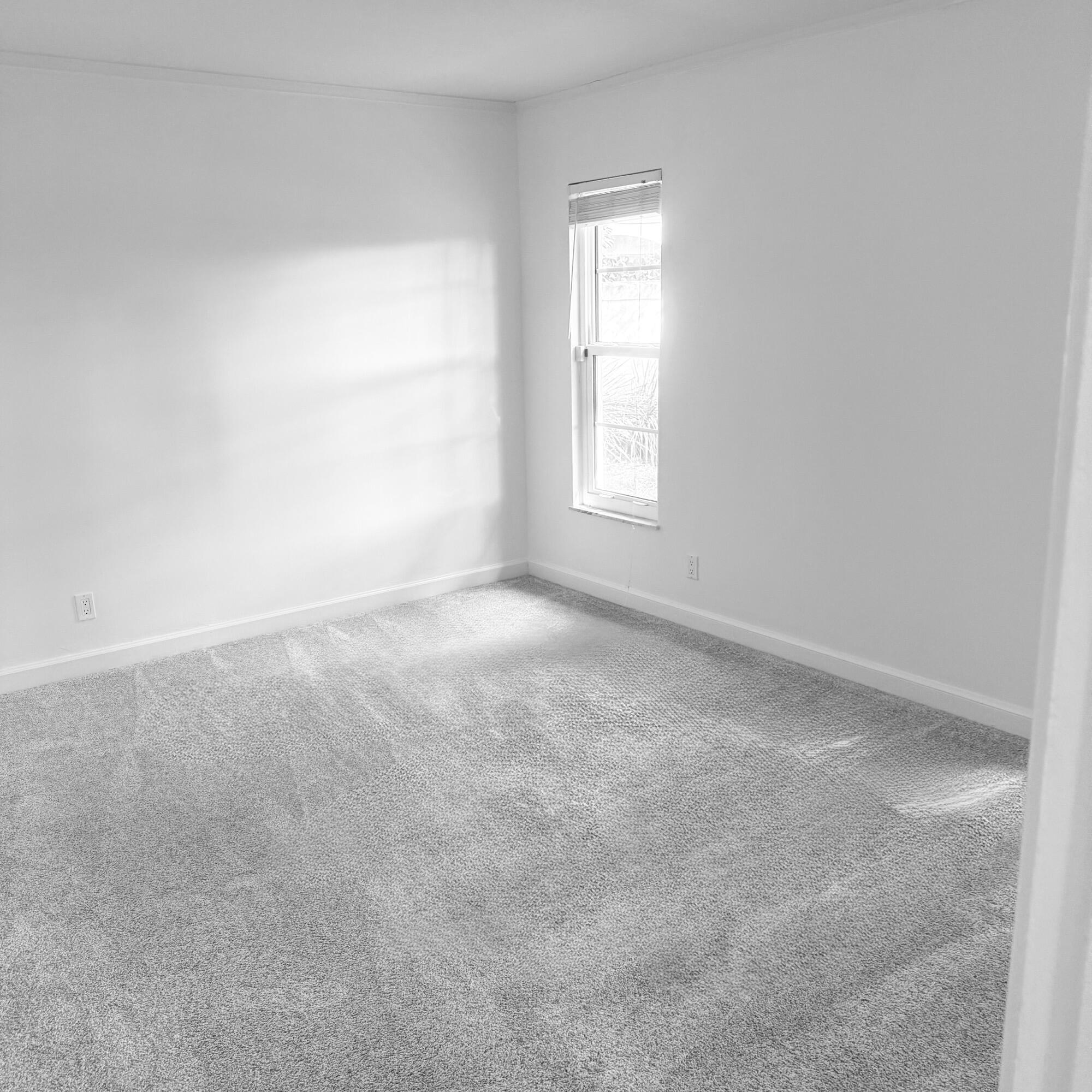 431 Jupiter Lakes Boulevard, Unit 2112A Jupiter, FL 33458 - Photo 9 of 19 an empty room with windows