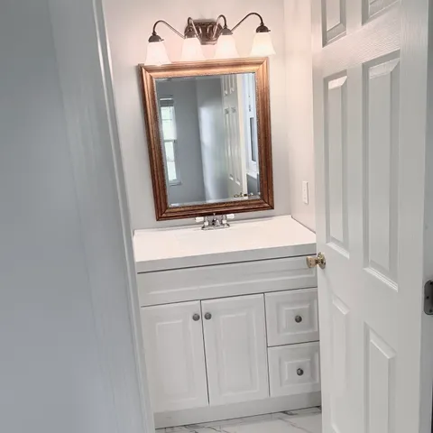 a bathroom with a toilet and shower