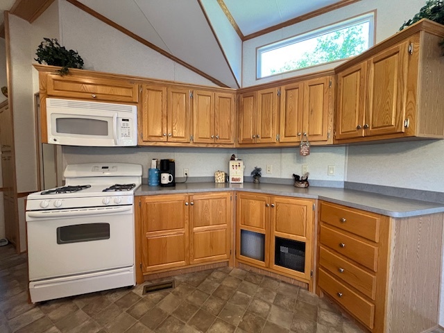 2795 East 28th Road Marseilles, IL 61341 - Photo 10 of 65 a kitchen with granite countertop a stove top oven sink and cabinets