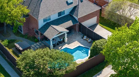 an aerial view of house with yard