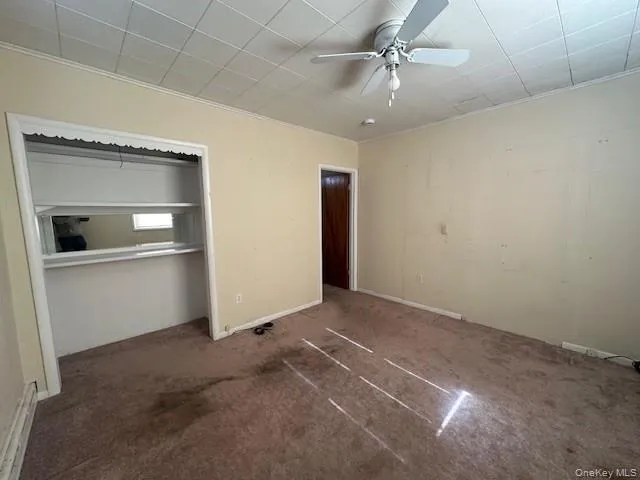 an empty room with a empty space and windows