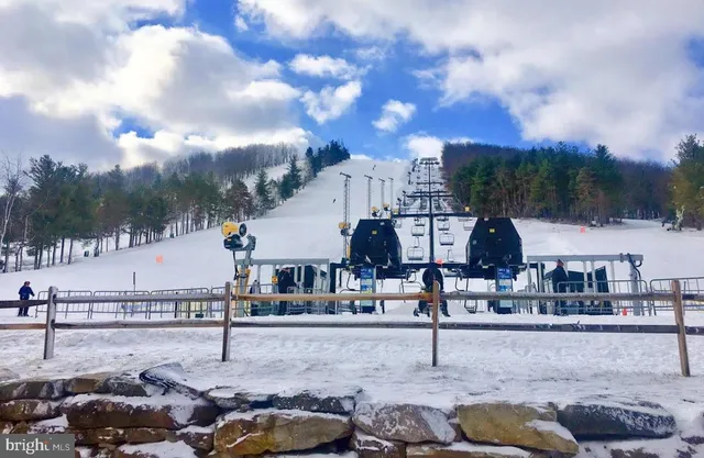 a view of multiple houses with outdoor space