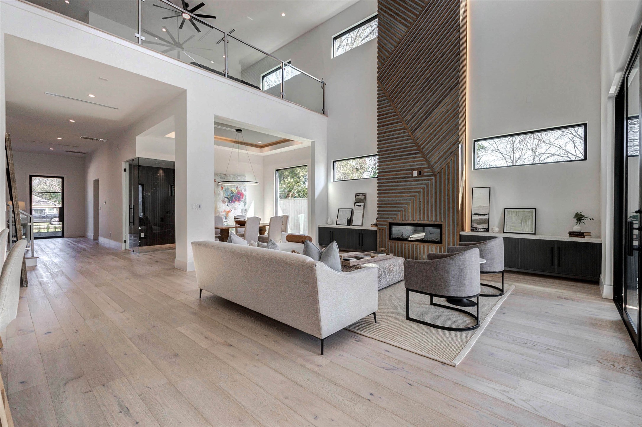 207 West 33rd Street Houston, TX 77018 - Photo 7 of 50 Grand entryway to the left welcomes you with soaring 12-foot ceilings, sleek lines, and a bright, airy feel that sets the tone for the entire home.