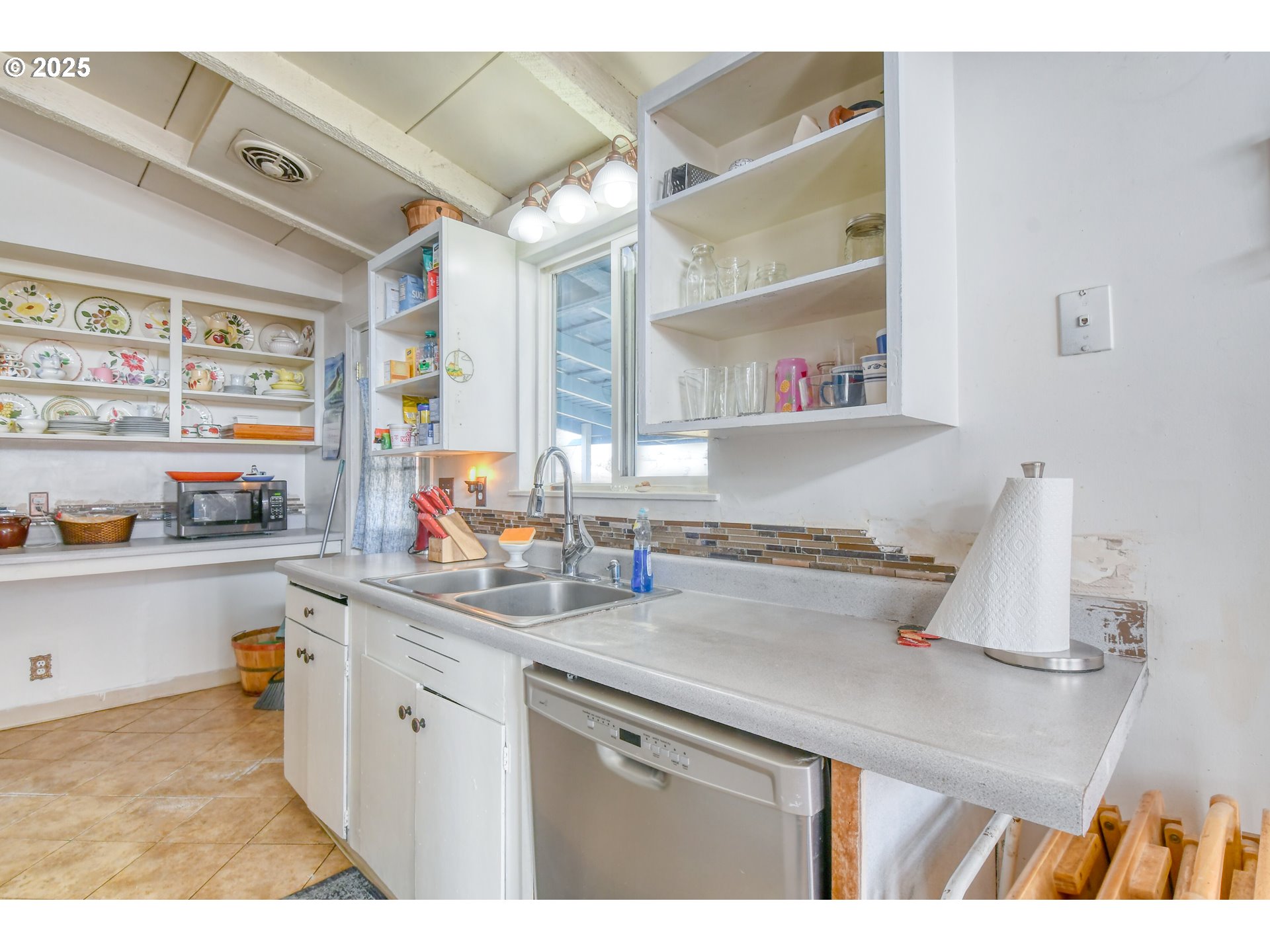 2805 Southwest Marshall Avenue Pendleton, OR 97801 - Photo 20 of 36 a kitchen with a sink a stove and cabinets