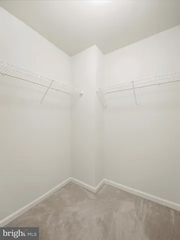 a bathroom with a double vanity sink toilet and shower