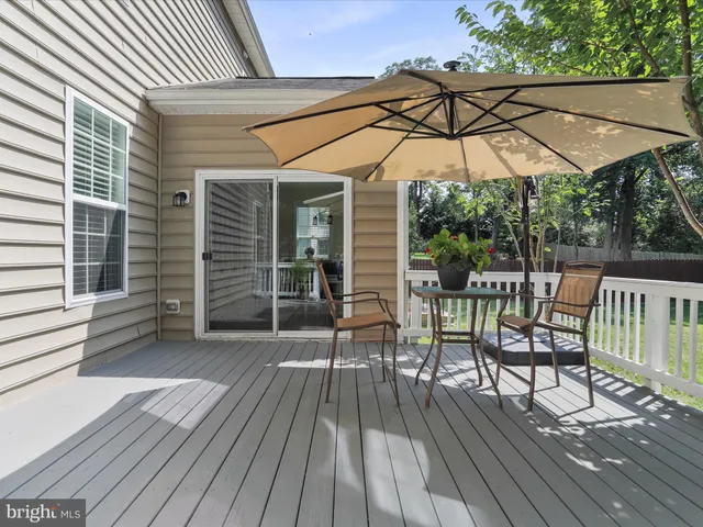 a view of a chair and table on the wooden floor