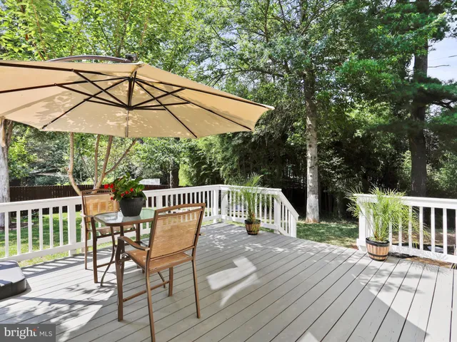 a front view of a house with a garden and yard