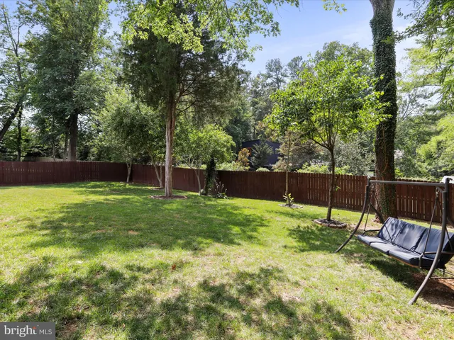 an aerial view of a house with yard