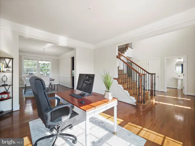 a workspace with table chair and a window