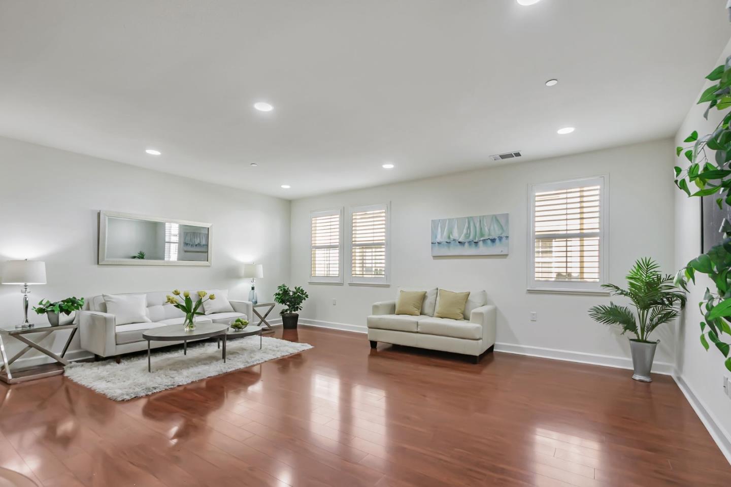 1142 Mente Linda Loop Milpitas, CA 95035 - Photo 1 of 36 a living room with furniture and a large window