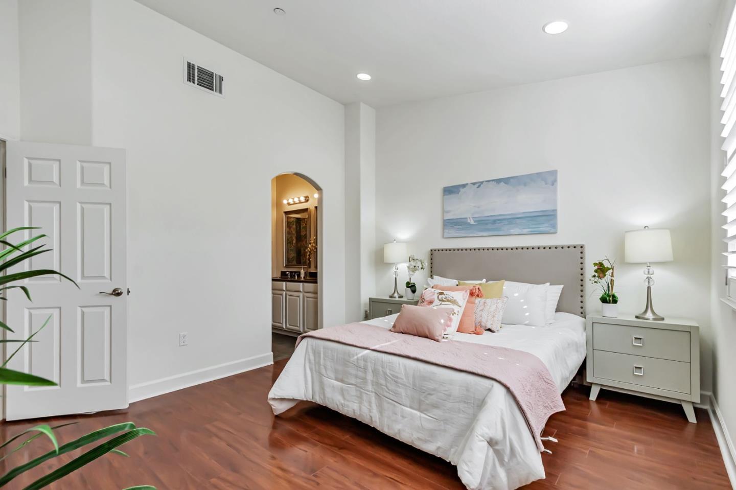 1142 Mente Linda Loop Milpitas, CA 95035 - Photo 16 of 36 a bedroom with a bed and wooden floor