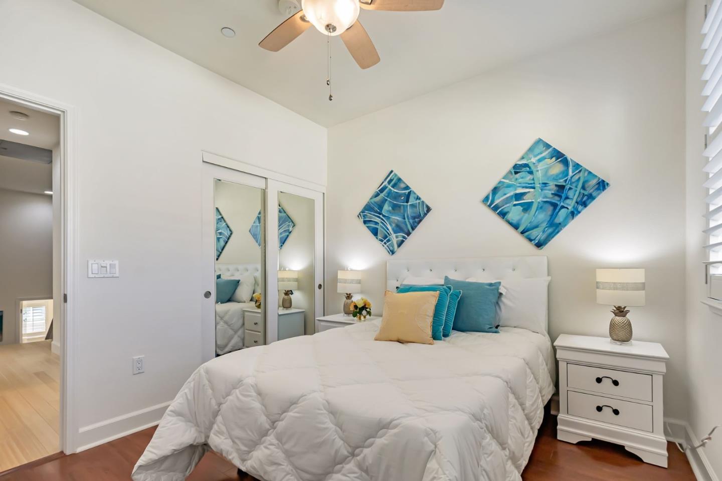 1142 Mente Linda Loop Milpitas, CA 95035 - Photo 18 of 36 a bedroom with a bed and a chandelier