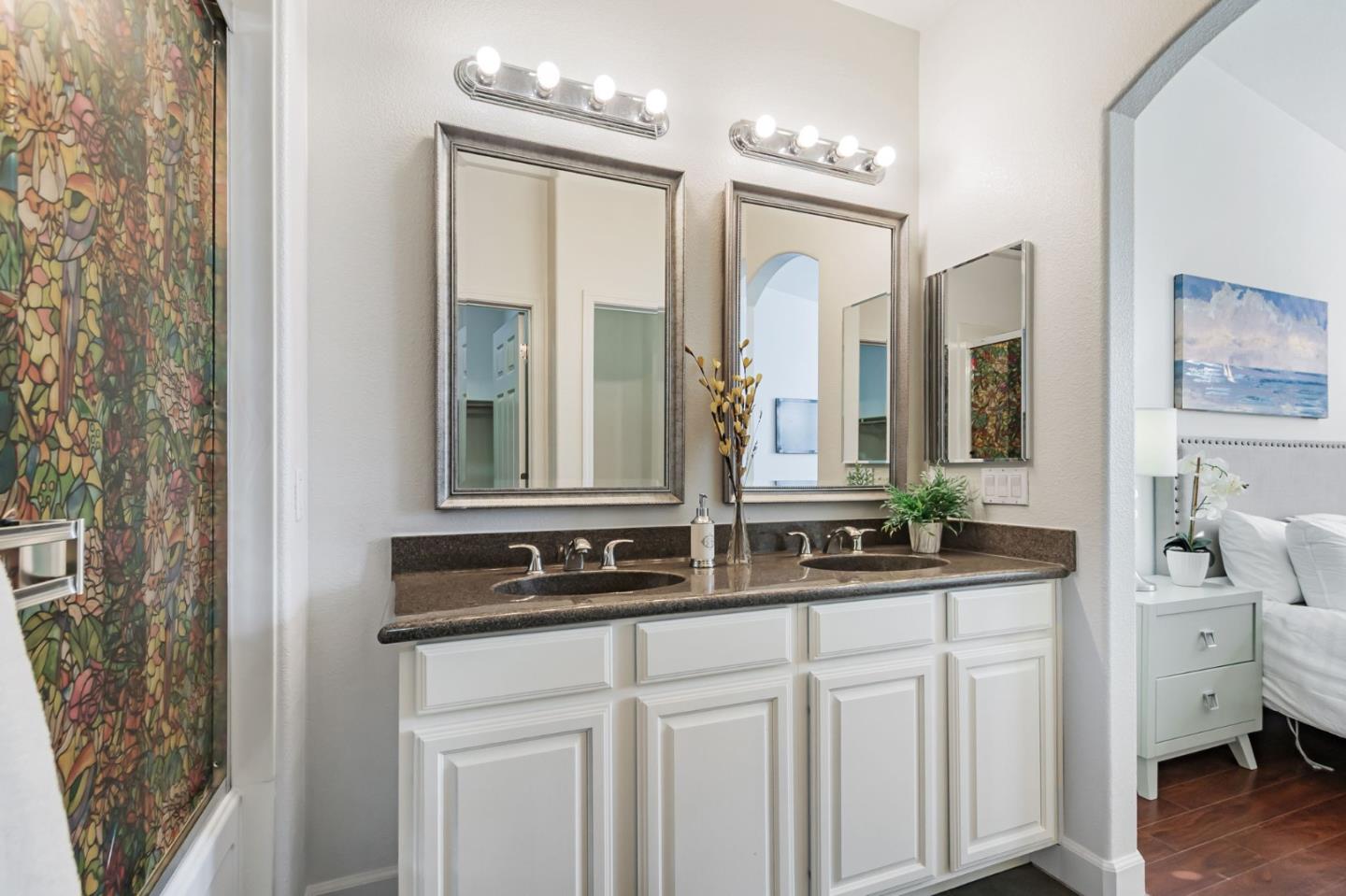 1142 Mente Linda Loop Milpitas, CA 95035 - Photo 24 of 36 a bathroom with a double vanity sink and a mirror