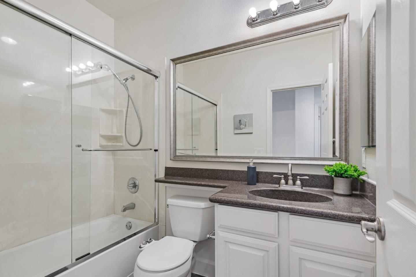 1142 Mente Linda Loop Milpitas, CA 95035 - Photo 25 of 36 a bathroom with a granite countertop sink toilet and shower