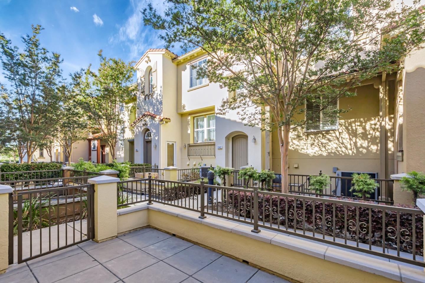1142 Mente Linda Loop Milpitas, CA 95035 - Photo 3 of 36 a view of a house with large windows and a table and chairs