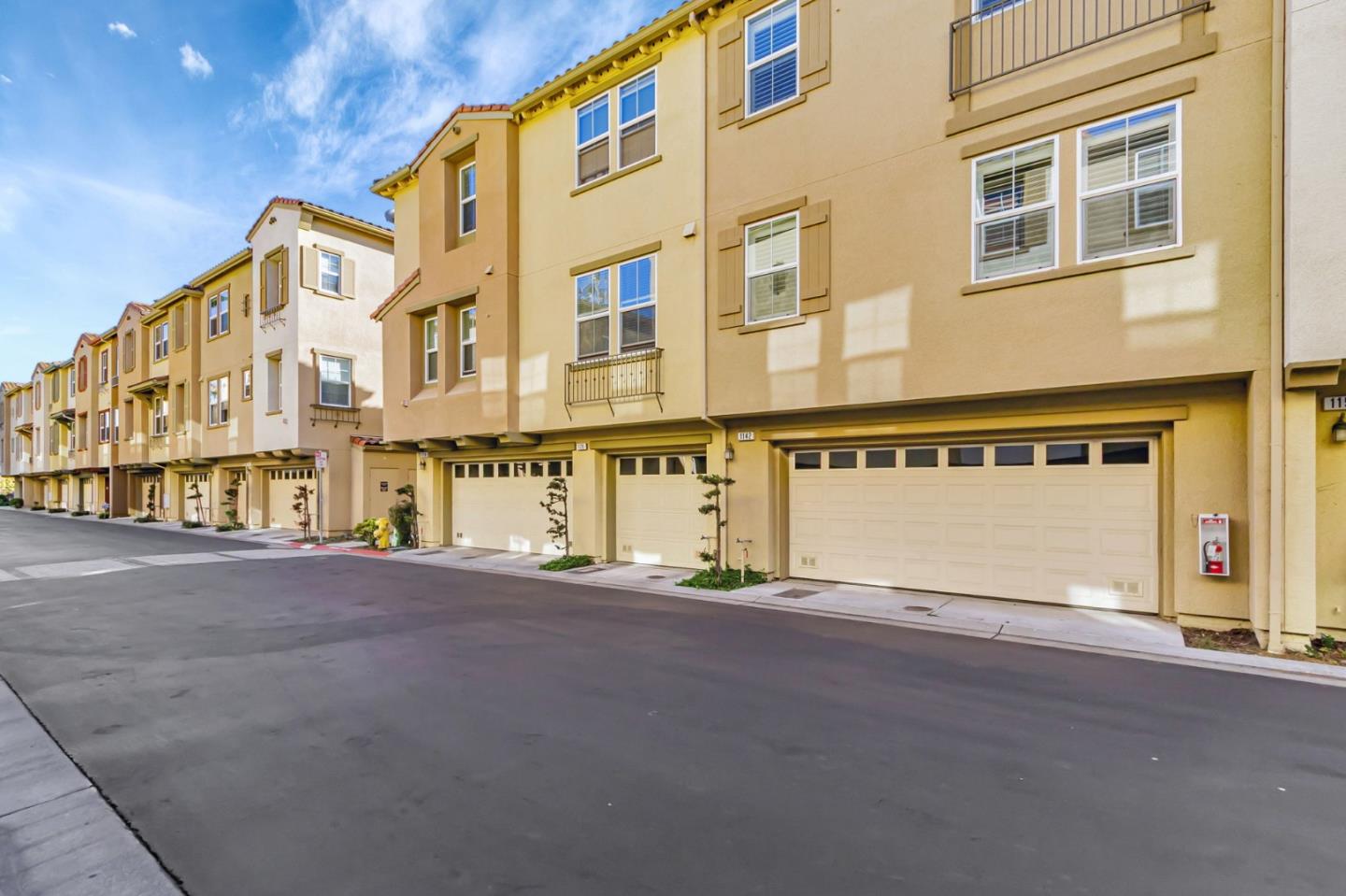 1142 Mente Linda Loop Milpitas, CA 95035 - Photo 33 of 36 a view of a building with car parked on the road