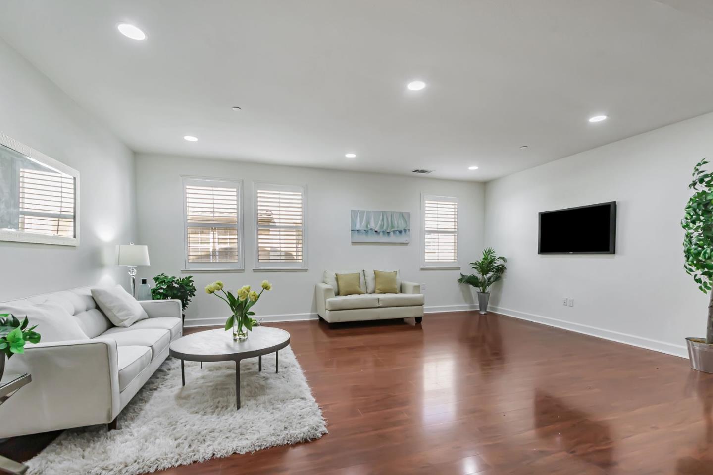 1142 Mente Linda Loop Milpitas, CA 95035 - Photo 4 of 36 a living room with furniture and a flat screen tv