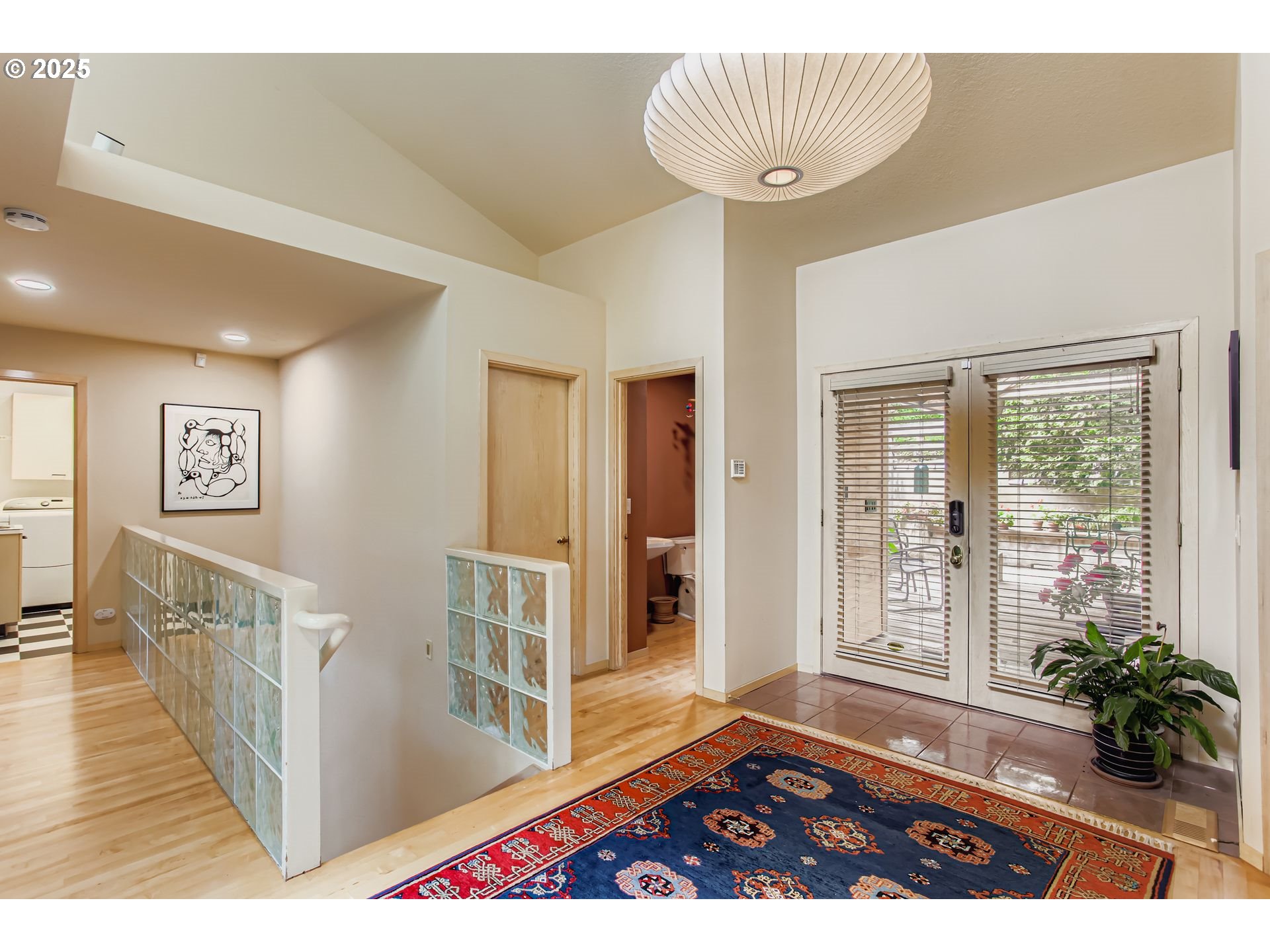 3902 Southwest Mt Adams Drive Portland, OR 97239 - Photo 12 of 38 a view of an entryway with wooden floor and a livingroom