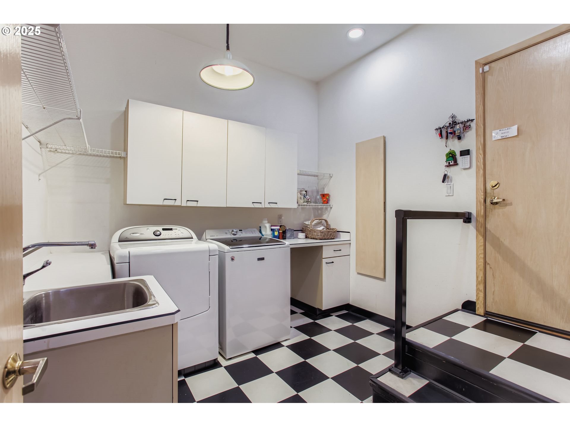 3902 Southwest Mt Adams Drive Portland, OR 97239 - Photo 18 of 38 a kitchen with a sink a refrigerator and a stove