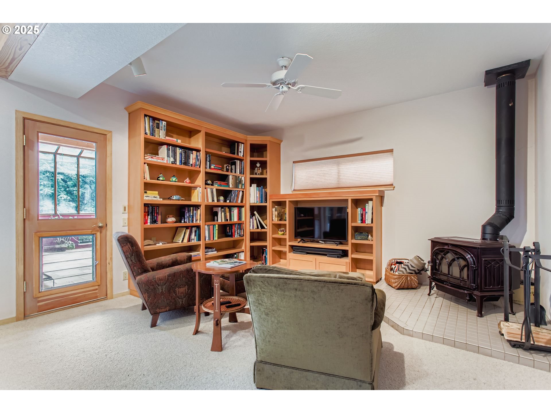 3902 Southwest Mt Adams Drive Portland, OR 97239 - Photo 19 of 38 a living room with furniture and a flat screen tv
