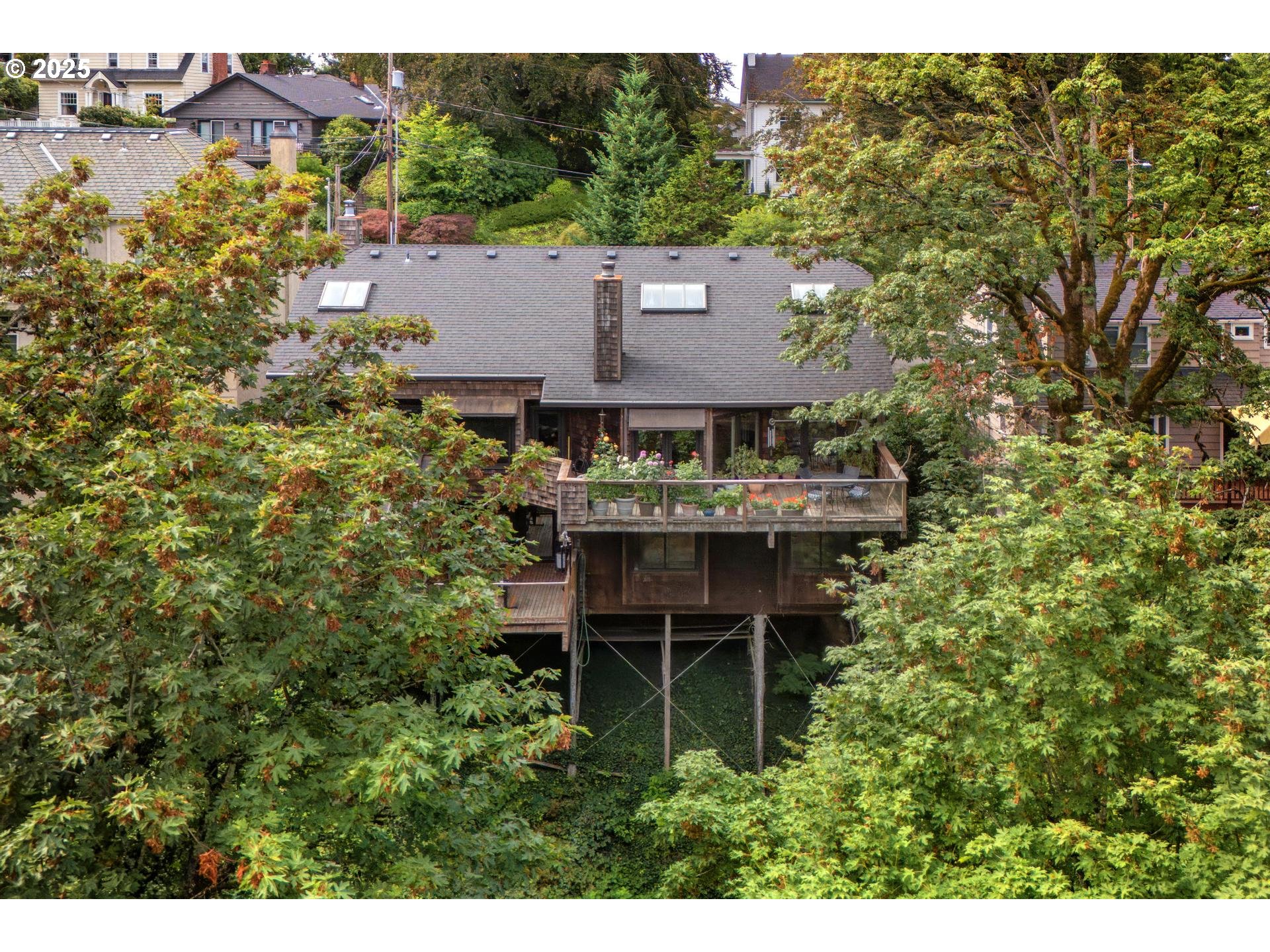 3902 Southwest Mt Adams Drive Portland, OR 97239 - Photo 29 of 38 an aerial view of a house with yard table and chairs