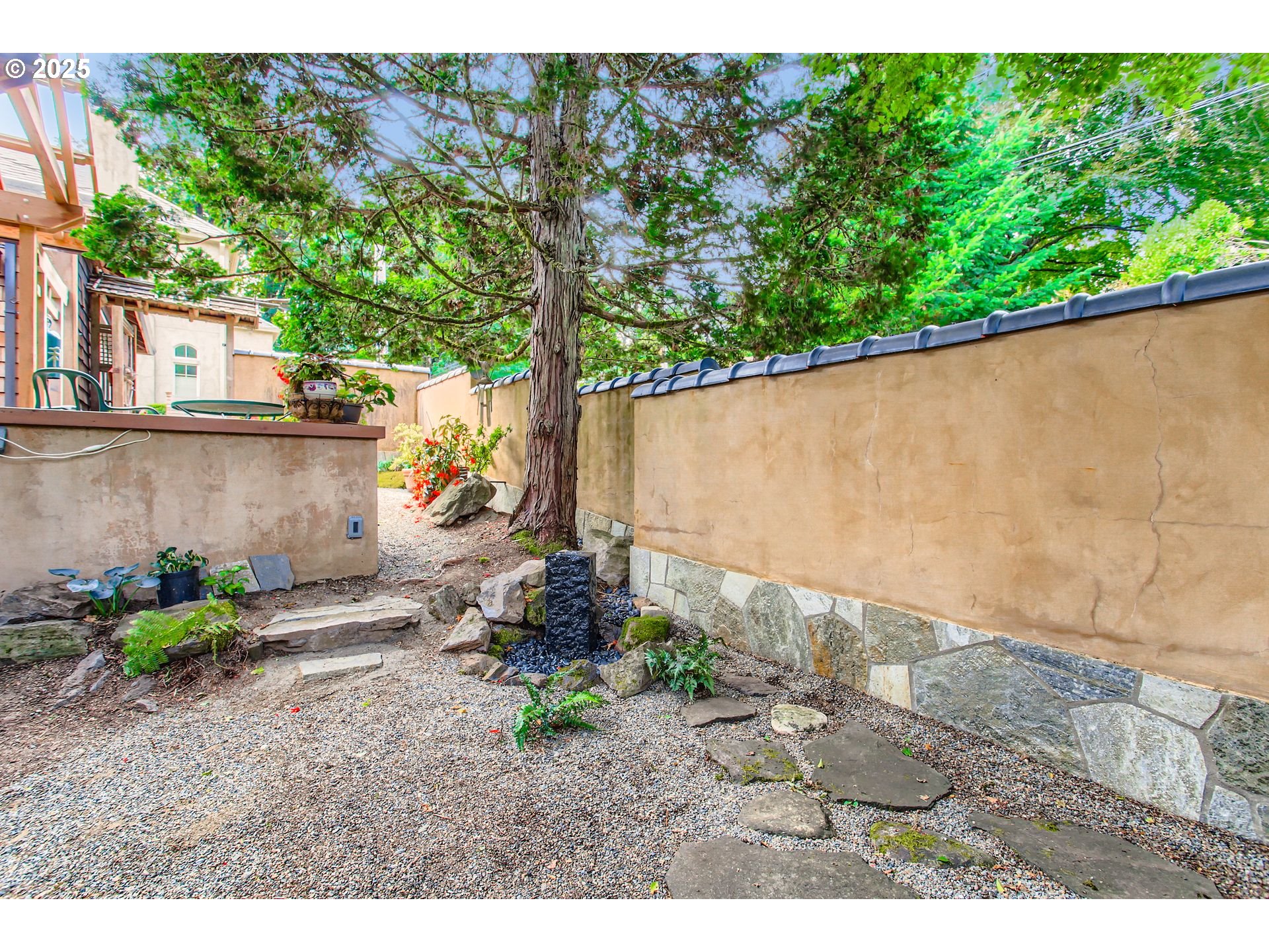 3902 Southwest Mt Adams Drive Portland, OR 97239 - Photo 33 of 38 a backyard of a house with a tree yard and outdoor seating