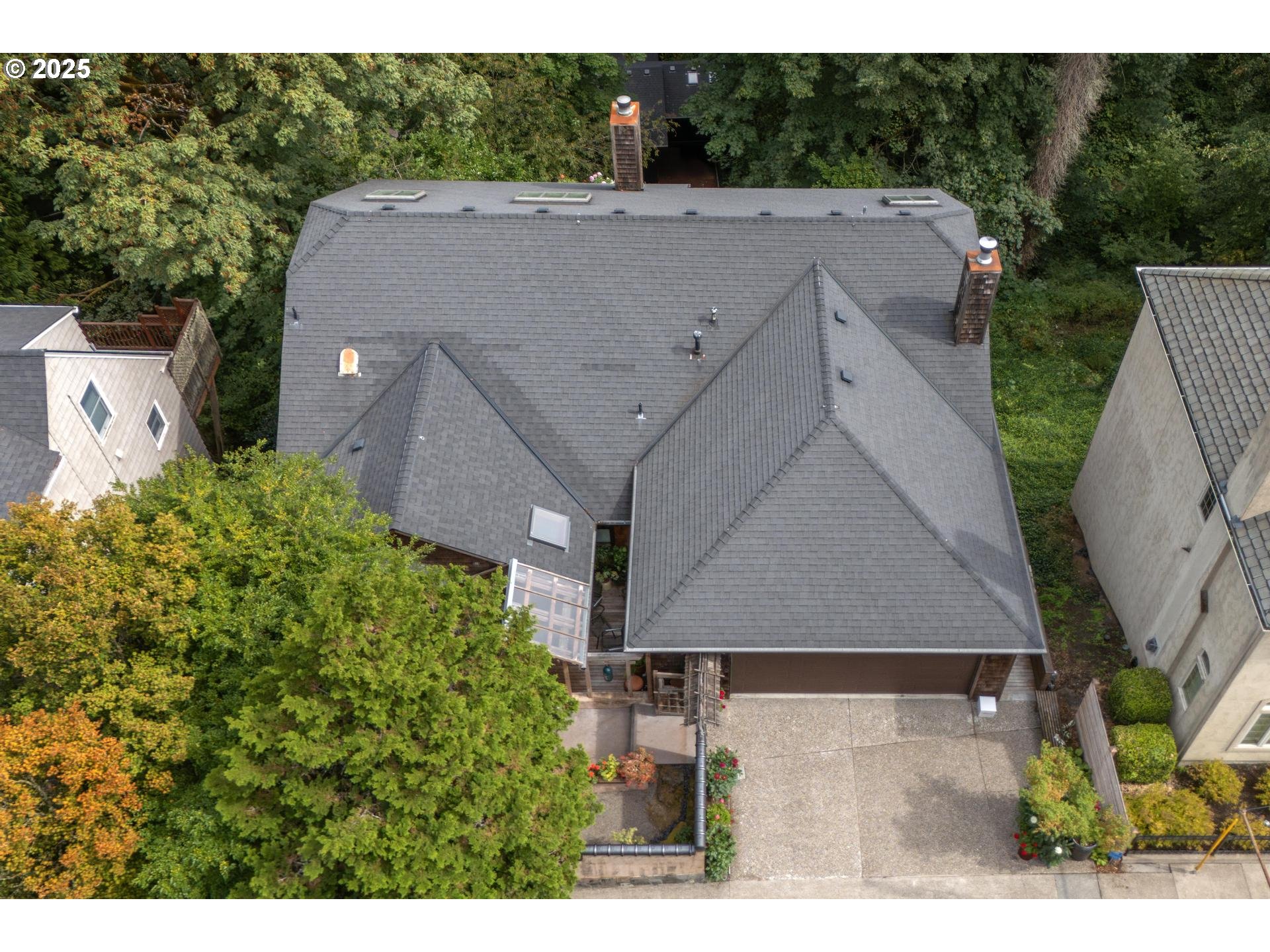 3902 Southwest Mt Adams Drive Portland, OR 97239 - Photo 36 of 38 a aerial view of a house with a yard and a large tree