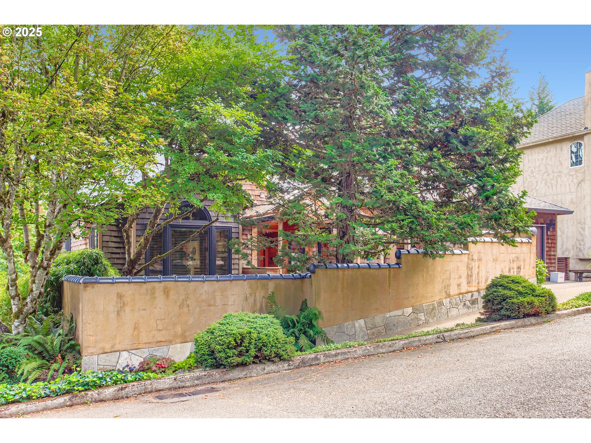 3902 Southwest Mt Adams Drive Portland, OR 97239 - Photo 37 of 38 a view of a house with a yard and sitting area