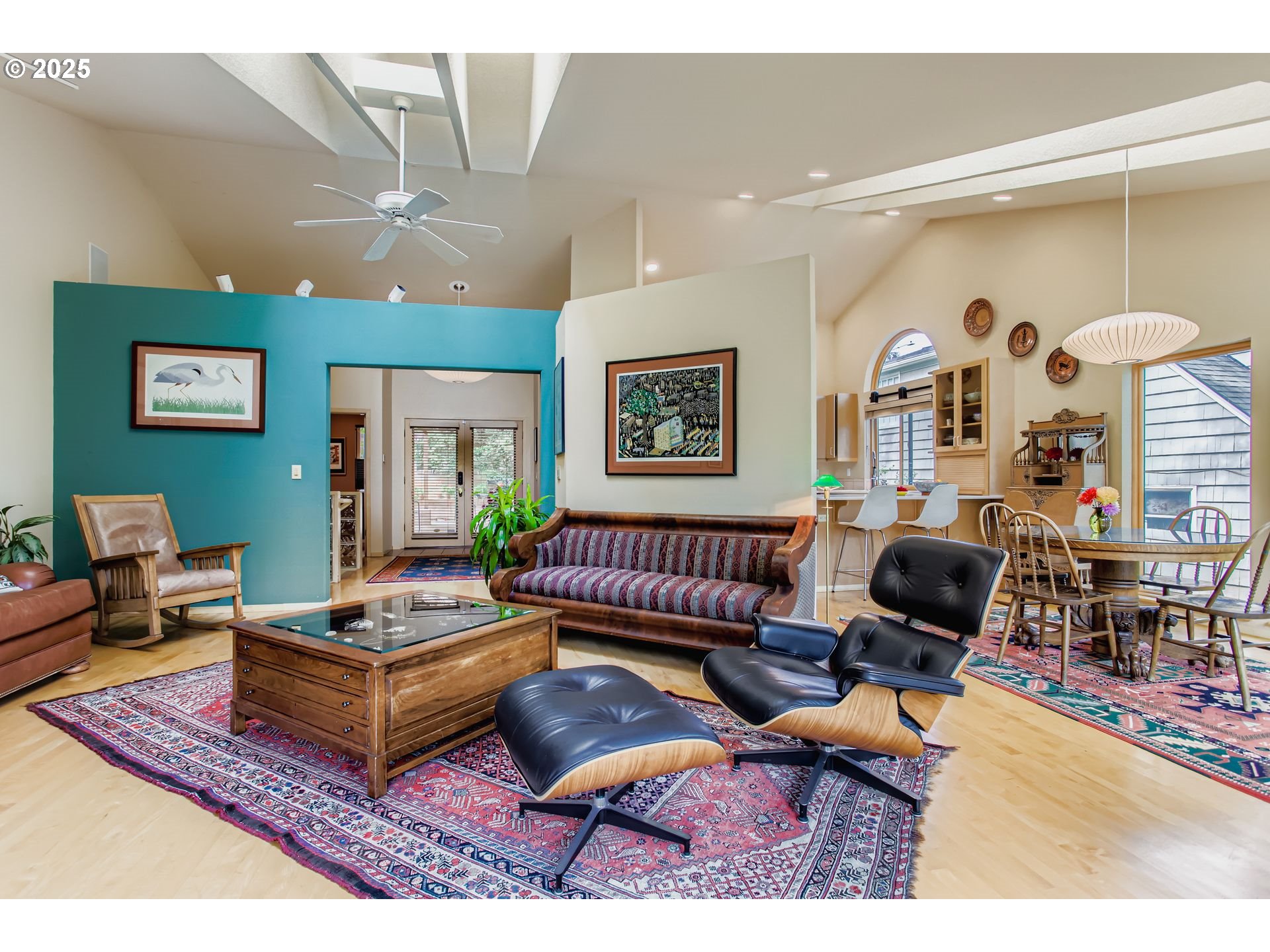 3902 Southwest Mt Adams Drive Portland, OR 97239 - Photo 4 of 38 a living room with furniture a rug and a chandelier