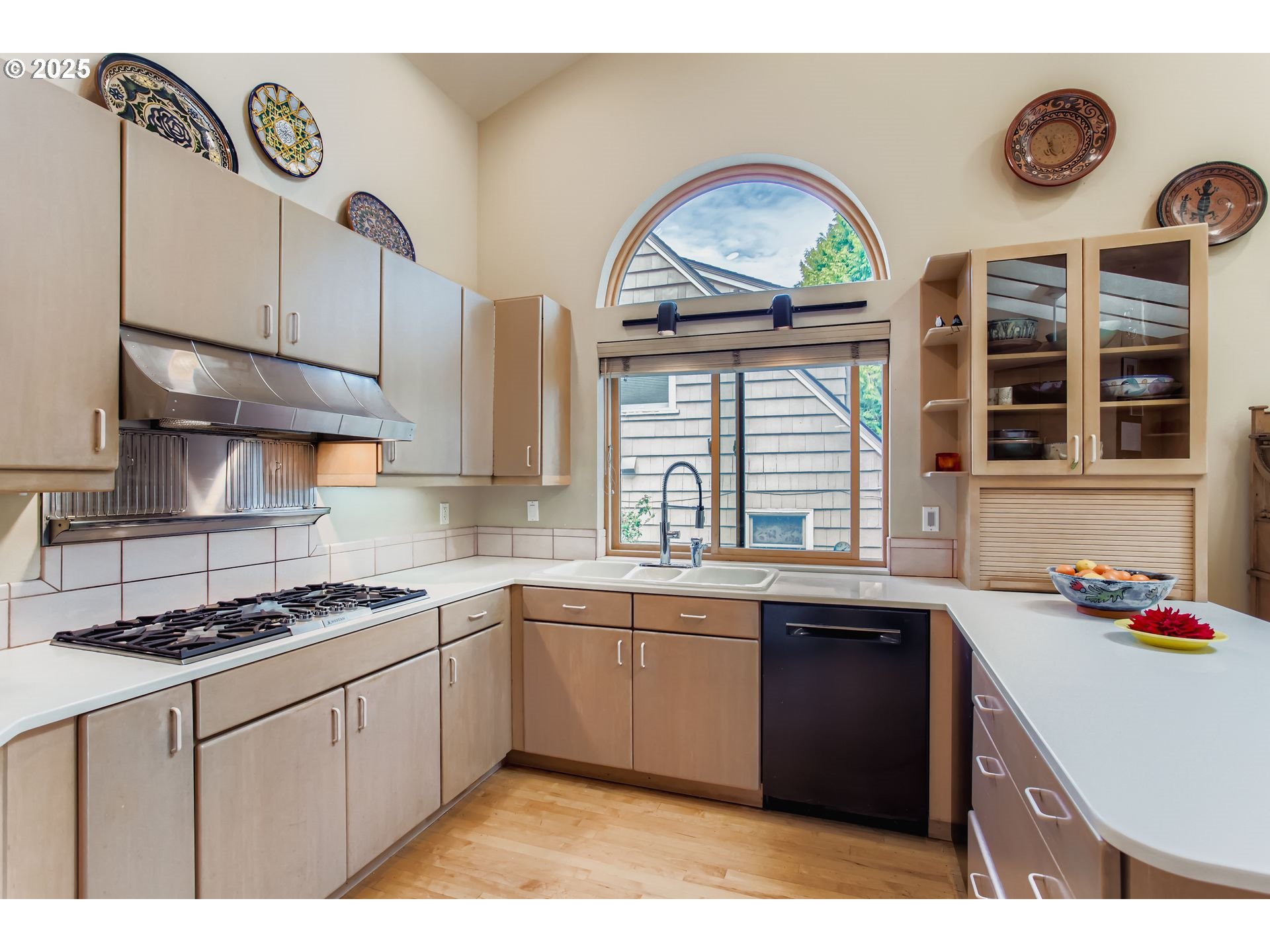 3902 Southwest Mt Adams Drive Portland, OR 97239 - Photo 7 of 38 a kitchen with a sink a stove and cabinets