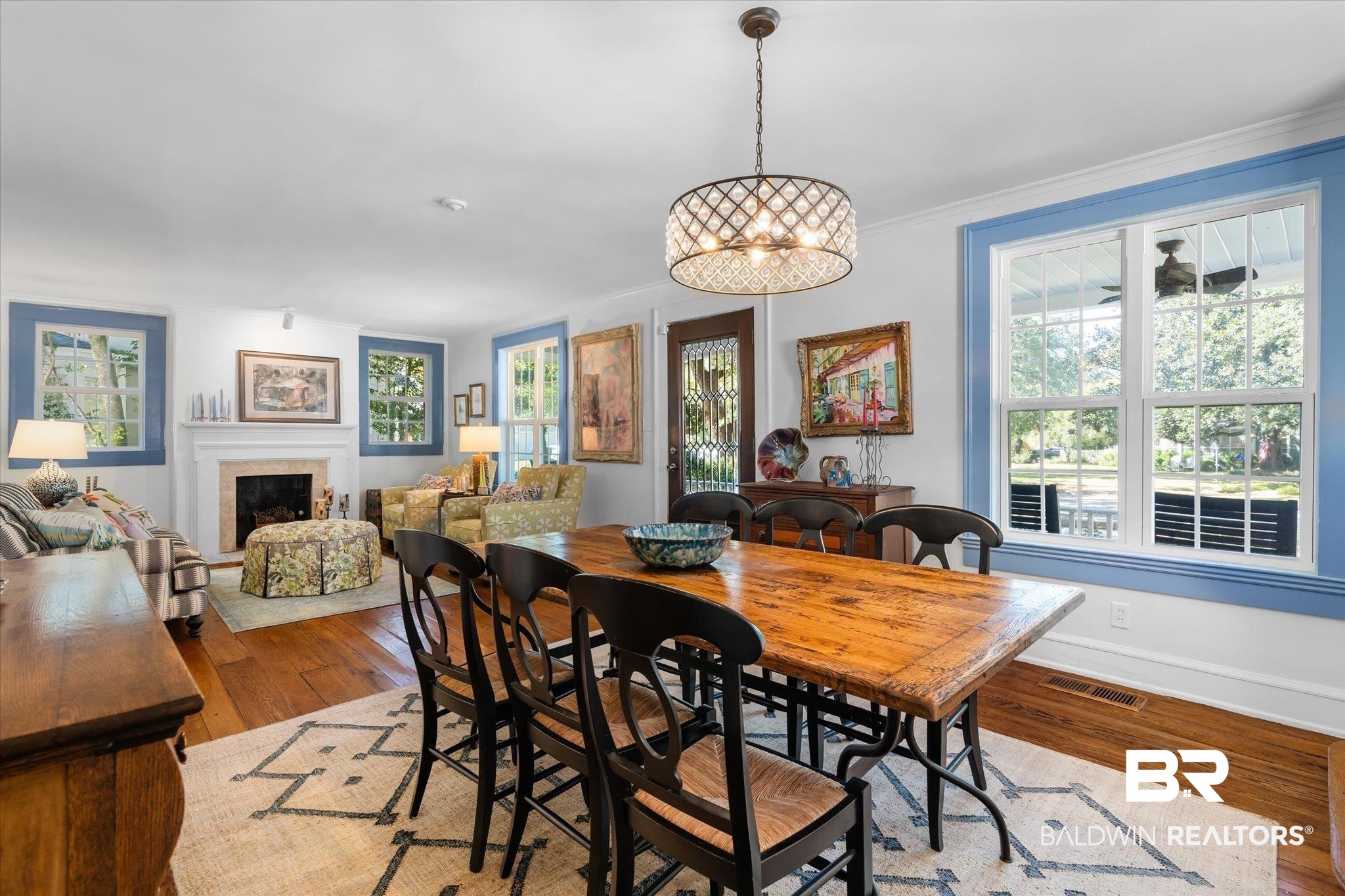 202 Woodlands Avenue Mobile, AL 36607 - Photo 3 of 53 Dining area with a notable chandelier, ornamental molding, and hardwood / wood-style flooring