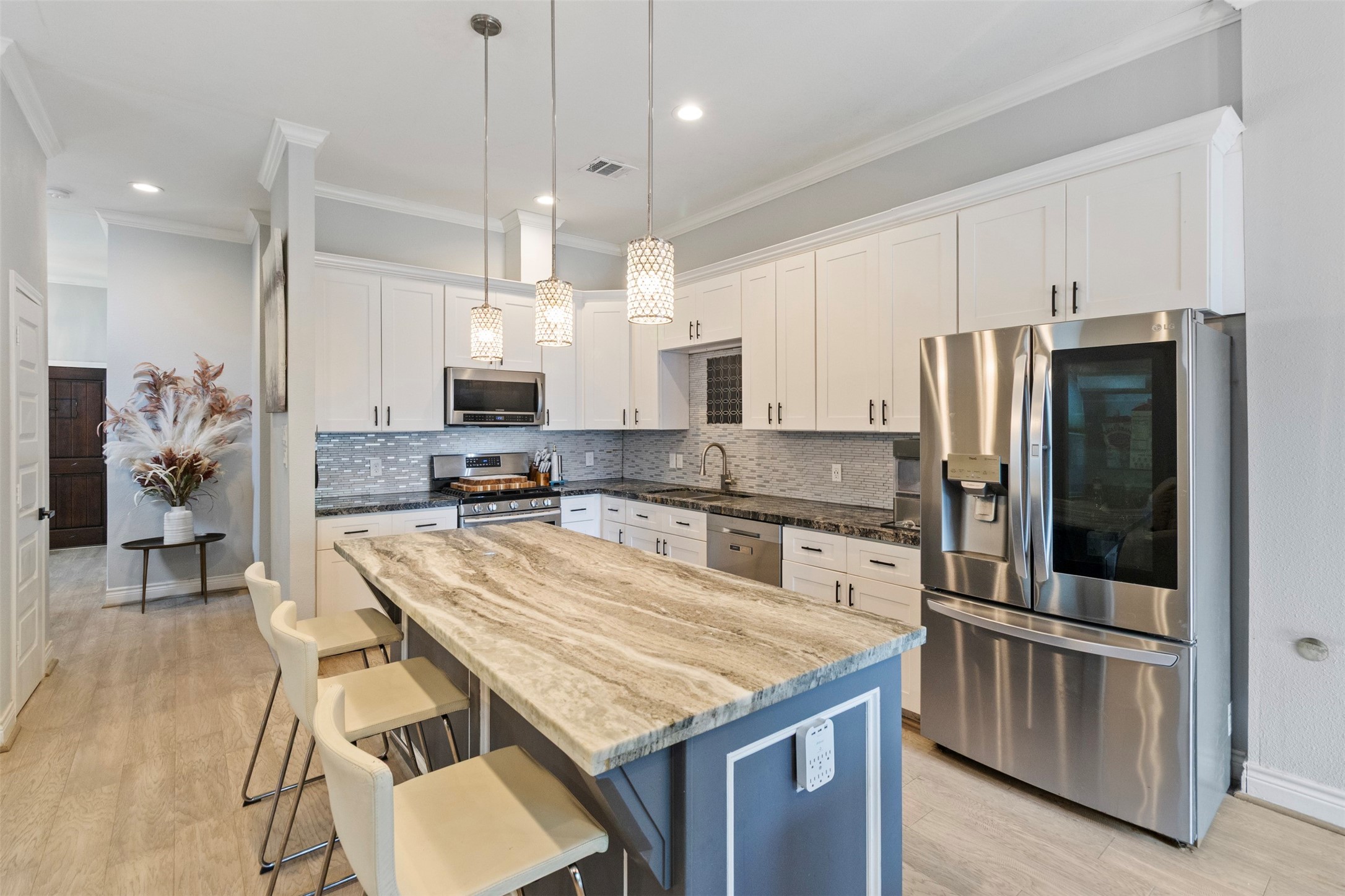 6706 Lozier Street Houston, TX 77021 - Photo 17 of 32 a kitchen with granite countertop a counter space stainless steel appliances and cabinets