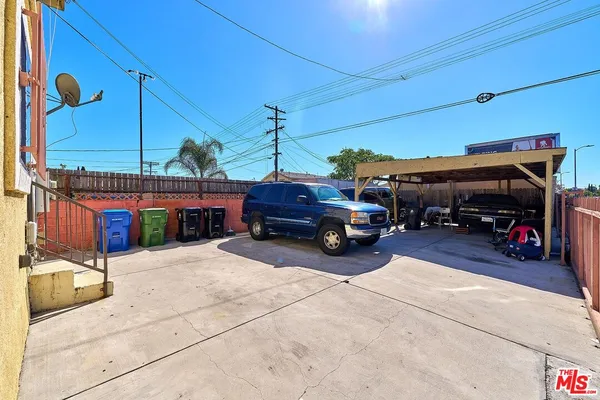a view of a cars park in front of house