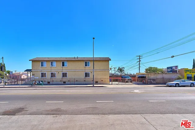 a view of a building and car parked
