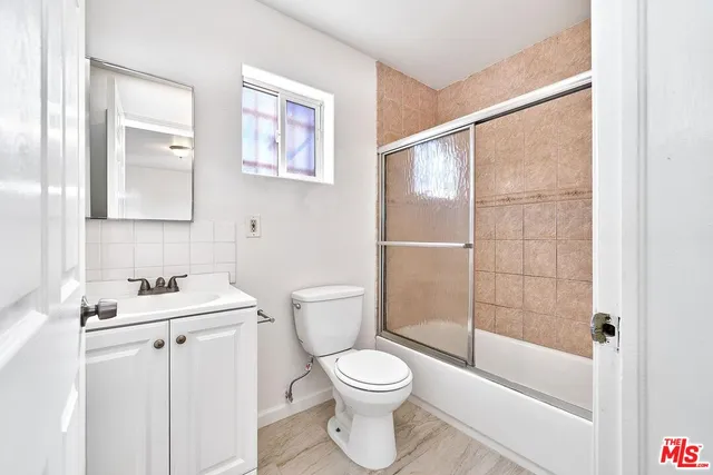 a bathroom with a toilet a sink and a bathtub