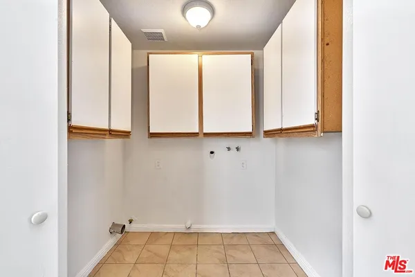 a view of an empty room with windows