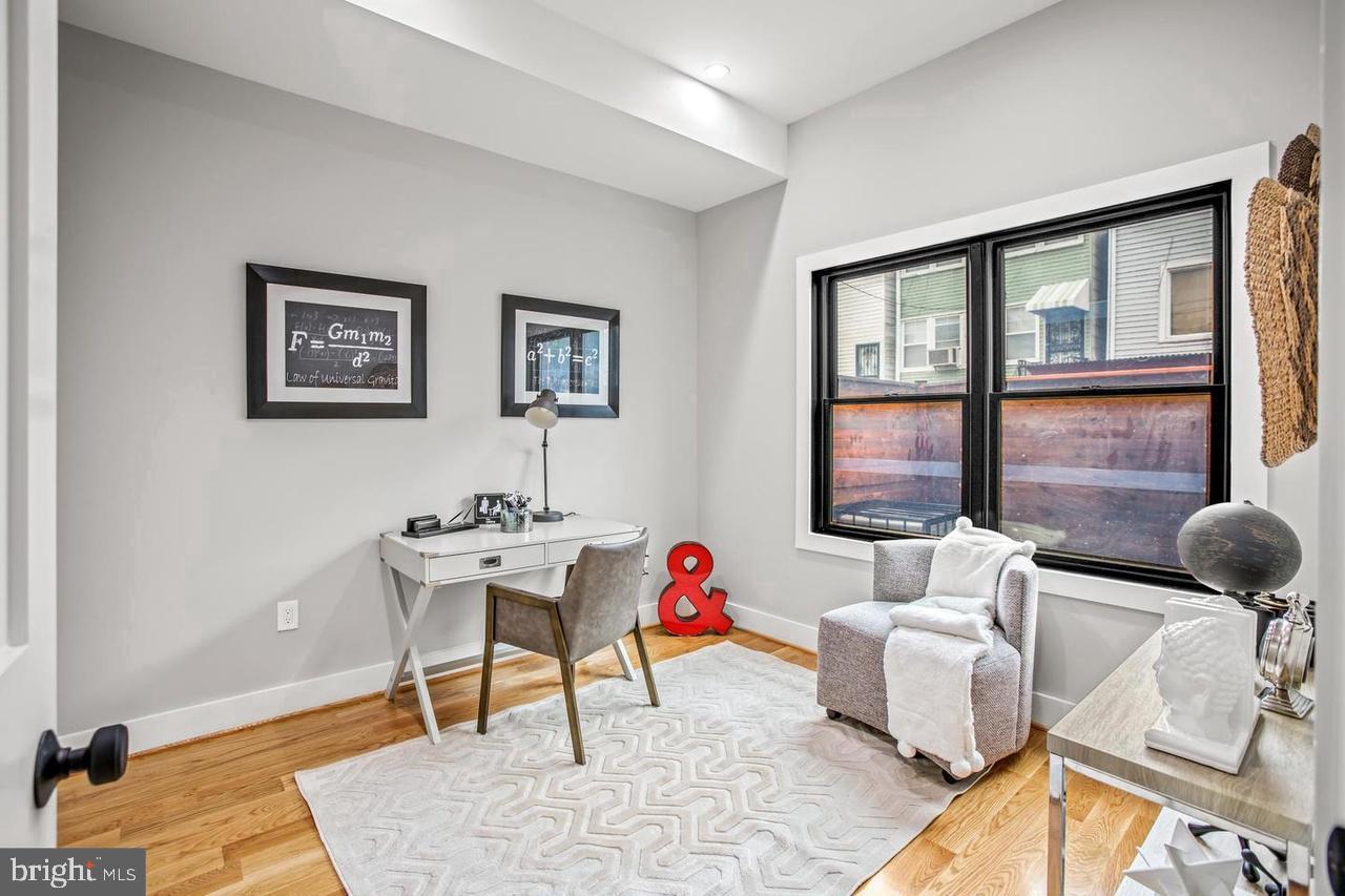 1420 Staples Street Northeast, Unit 2 Washington, DC 20002 - Photo 11 of 17 a living room with furniture and a window