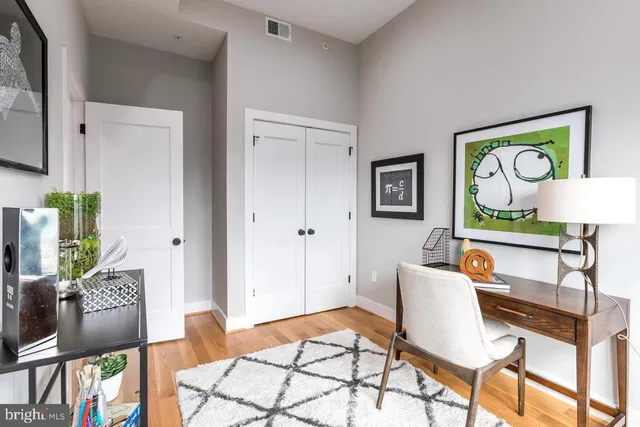 a living room with furniture and a rug