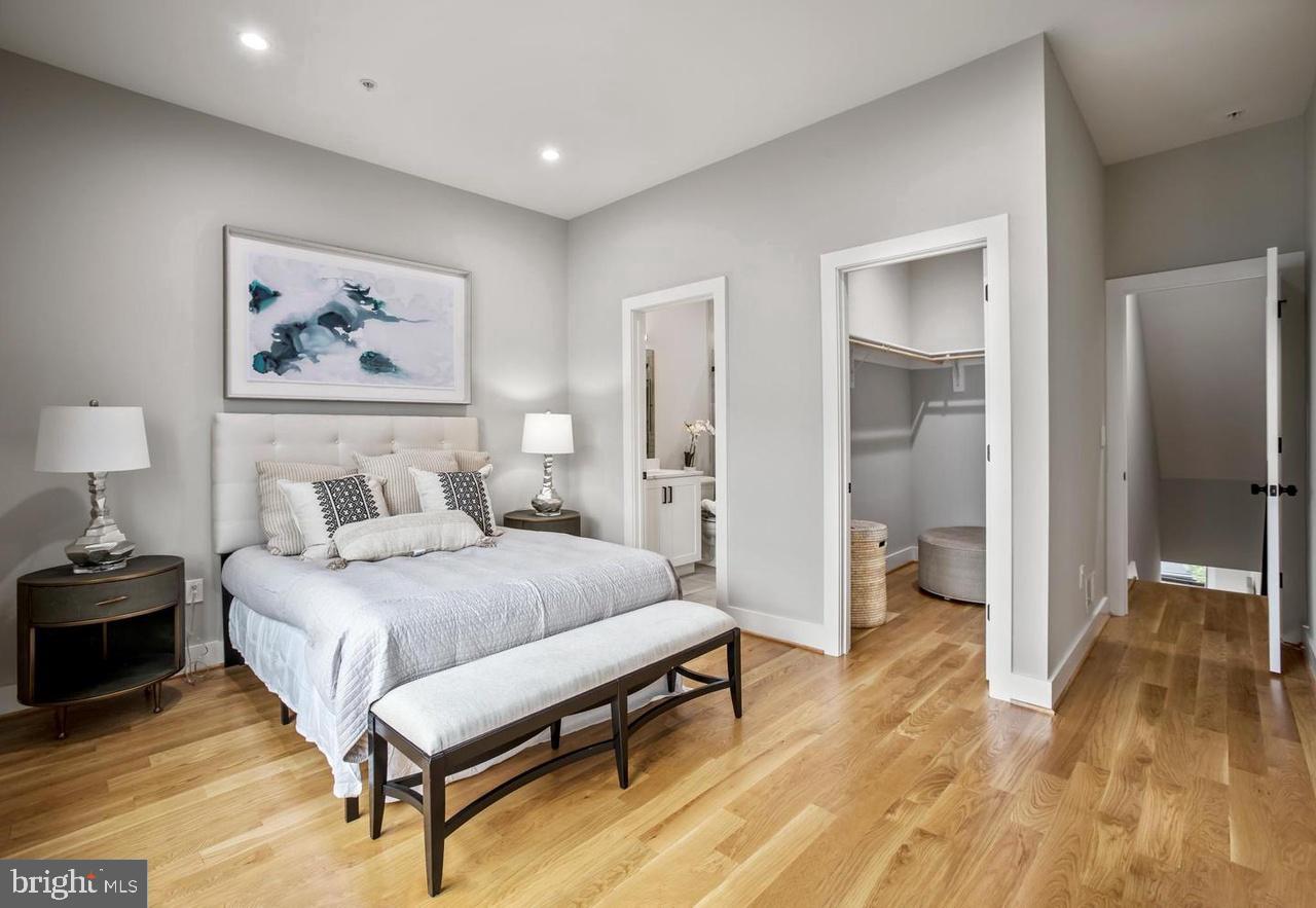 1420 Staples Street Northeast, Unit 2 Washington, DC 20002 - Photo 13 of 17 a bedroom with a bed and a painting on the wall