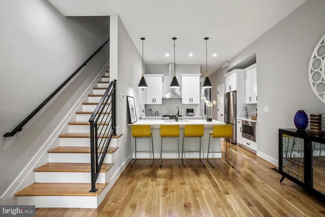 a view of a living room and wooden floor